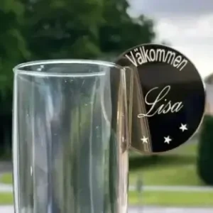 a glass with a name tag