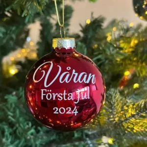 a red ornament with white text on it